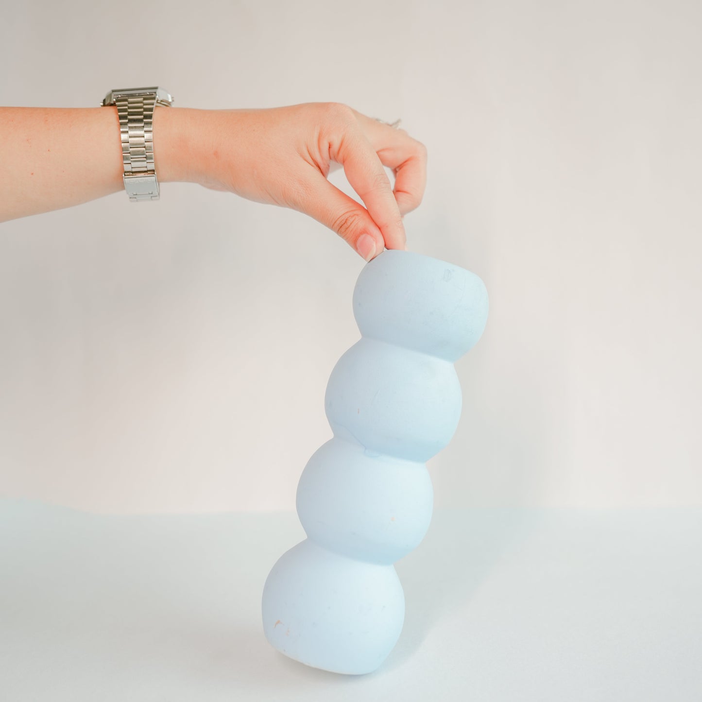 Stacked tiered pottery vase with crochet yellow Lily